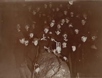Class of 1898 digging up the 1898 boulder